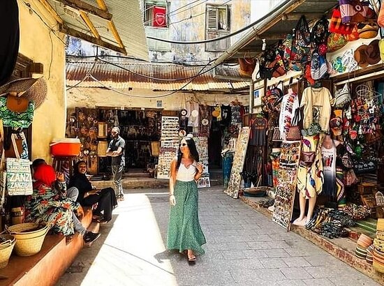 A traveler politely decline a street vendor's offer